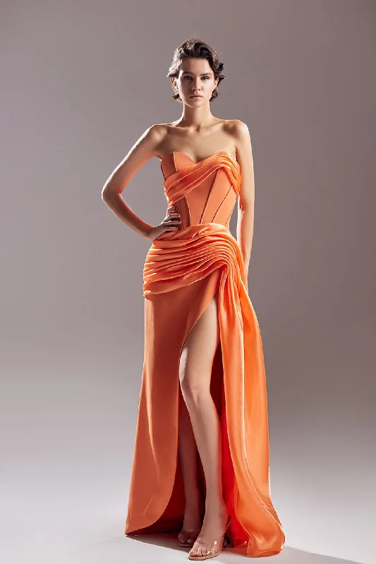 Corseted bodice draped waistline high slit dress